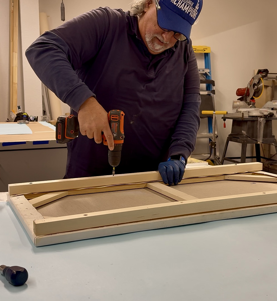 Fred at Work Constructing a Wooden Frame